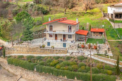 an aerial view of a house on a hill at Chalet Perivoli in Perivólion
