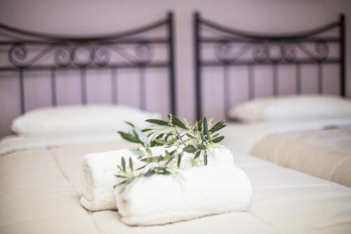 Ένα ή περισσότερα κρεβάτια σε δωμάτιο στο Vassilis Guest House 