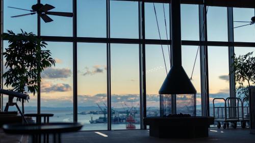 a large window in a building with a view of the ocean at ORIENTAL HOTEL in Kobe