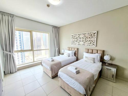 Postel nebo postele na pokoji v ubytování Panoramic view next to JBR beach