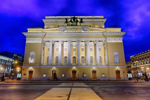 a large white building at night at Park Inn by Radisson Pulkovo Airport in Saint Petersburg