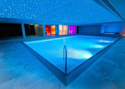 a swimming pool in a house with stars on the ceiling at DoubleTree by Hilton Harrogate Majestic Hotel & Spa in Harrogate