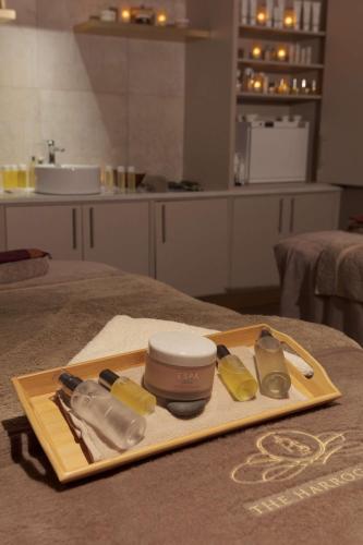 a wooden cutting board with some kitchen utensils on a table at DoubleTree by Hilton Harrogate Majestic Hotel & Spa in Harrogate