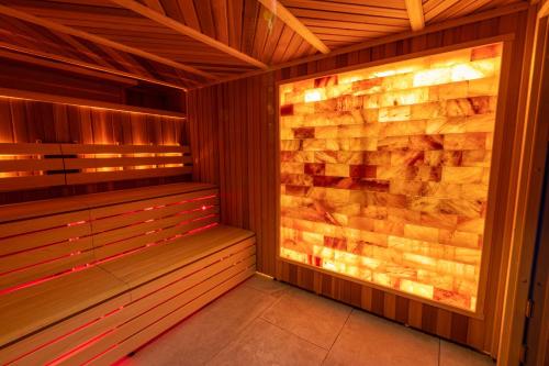 an empty sauna with wooden walls and wooden floors at DoubleTree by Hilton Harrogate Majestic Hotel & Spa in Harrogate