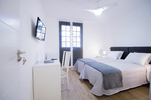 Postel nebo postele na pokoji v ubytování Las Palmas Smart Rooms