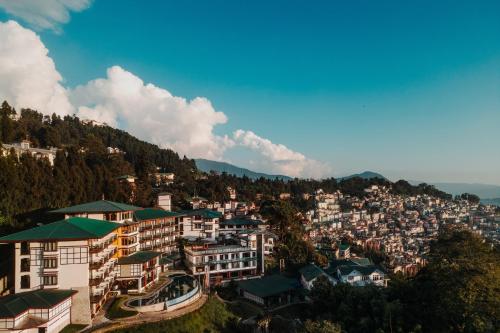 a view of a city with buildings on a hill at Denzong Regency- Luxury Mountain Retreat Spa & Casino in Gangtok