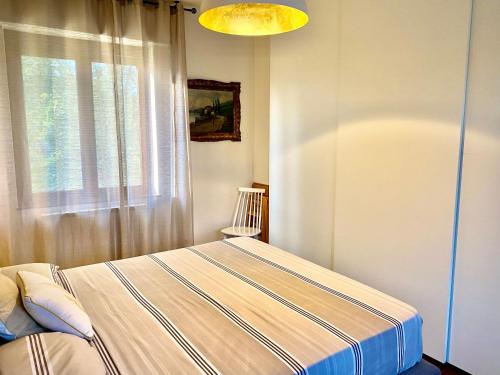 Tempat tidur dalam kamar di Alloggio Marta Malpensa Milano-Laghi