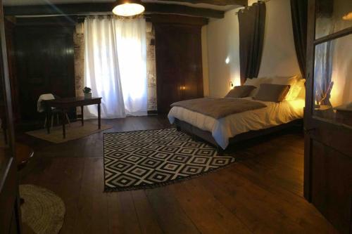Postel nebo postele na pokoji v ubytování Gîte de charme Monpazier Dordogne Périgord