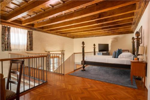 Cama o camas de una habitación en Loggiato Dei Serviti