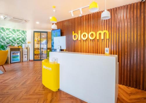 a store with a yellow and white counter in a room at Bloom Hotel - HSR Layout Sec 6 in Bengaluru