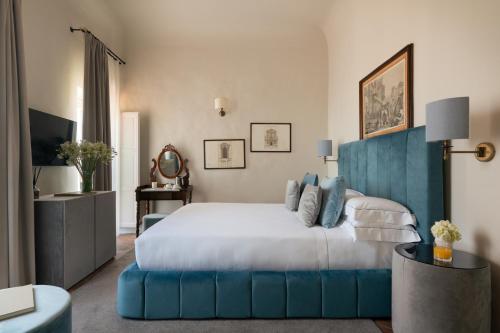 Cama o camas de una habitación en Loggiato Dei Serviti