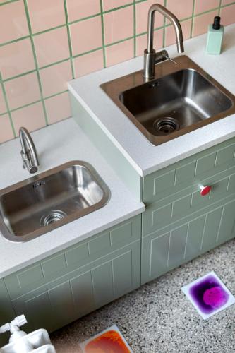a kitchen with two sinks and a counter top at Sopociaki in Sopot