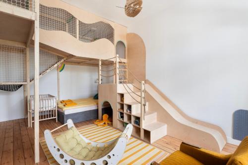 a room with a bunk bed and a staircase at Sopociaki in Sopot