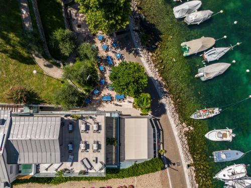 an overhead view of a building and boats in the water at Gabbiano in Malcesine