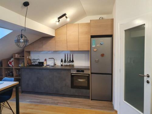 Η κουζίνα ή μικρή κουζίνα στο Apartman RedBrick