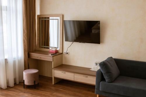 TV a/nebo společenská místnost v ubytování Graff Hotel
