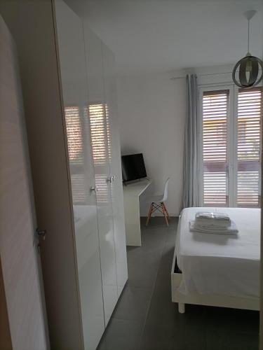 TV a/nebo společenská místnost v ubytování B&B Al Porticciolo