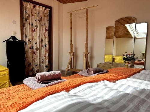 a bedroom with two beds with towels on them at Natur Atempause Schwarzwald in Horb am Neckar