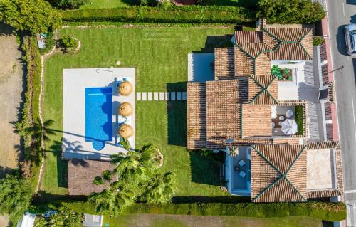 an overhead view of a house with a yard at VACATION MARBELLA I Villa Sirio, Golf-Front Villa, Private Pool, Privacy in Marbella