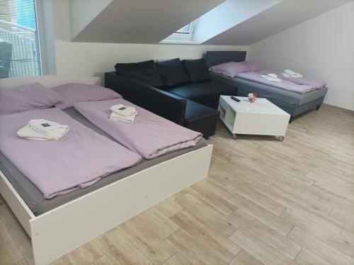A bed or beds in a room at Ubytování u Leoše