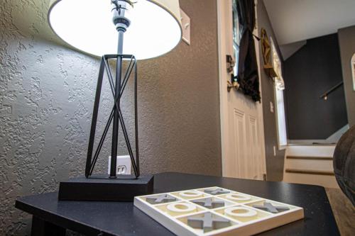 a lamp sitting on top of a black table at Mountain Haven Dragon's Nest Cabin in Robbinsville