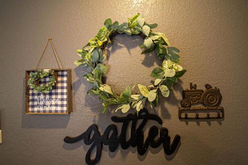 a christmas wreath with a train on a wall at Mountain Haven Dragon's Nest Cabin in Robbinsville