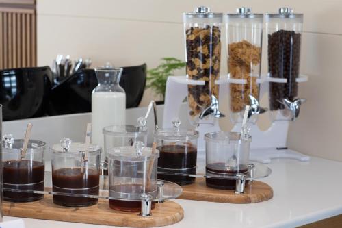 a group of glass containers filled with chocolate pudding at Batumi View Luxury in Batumi