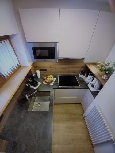 an overhead view of a kitchen with a counter top at Ferienwohnungen am Lärchenweg in Sesto