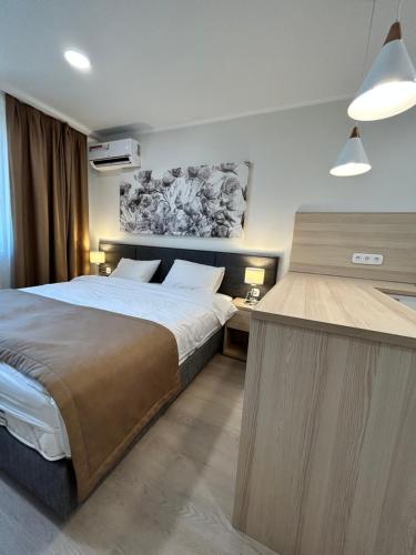Łóżko lub łóżka w pokoju w obiekcie Apart Astana