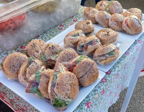 a display of sandwiches and pastries on a table at Micosta Leisure Inn in Hudson
