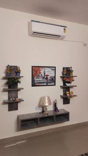 a room with a shelf on the wall at Yb home in Sonīpat