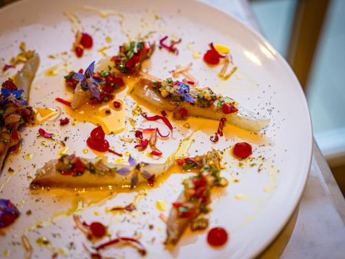a white plate with some food on it at Château de Candie in Chambéry