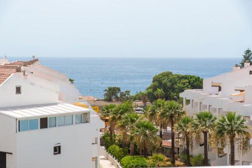 a view of the ocean from a building at Paloma Beach Apartments in Los Cristianos