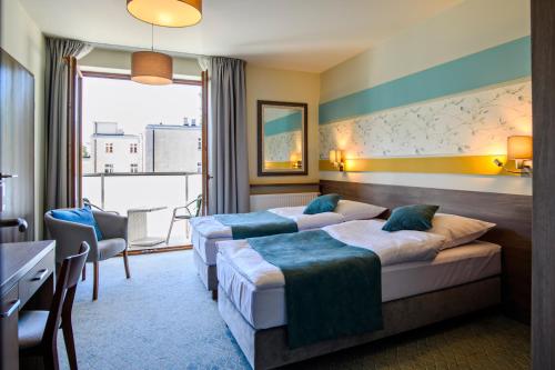 Hotel Brzozówkaにあるベッド