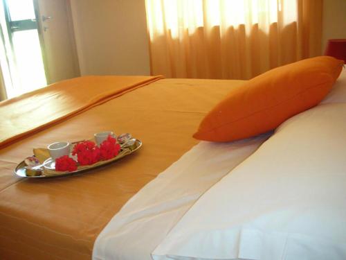 a plate of food on top of a bed at Hotel Park in Rossano