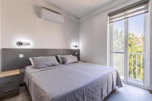 Postel nebo postele na pokoji v ubytování Velvet Noir Apartment by Soea