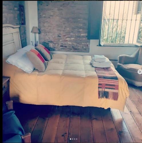 Ένα ή περισσότερα κρεβάτια σε δωμάτιο στο Hostería Casa de Campo