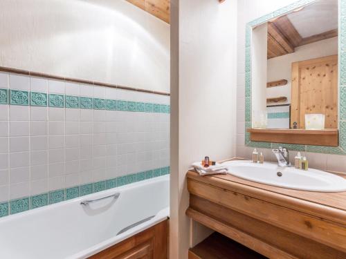 a bathroom with a sink and a mirror at Appartement de charme avec balcon, 8 pers, décor raffiné, au cœur de Val-d’Isère, proche des pistes - FR-1-694-106 in Val dʼIsère