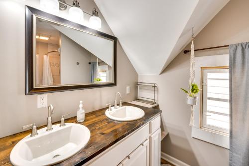 a bathroom with two sinks and a large mirror at Pet-Friendly Home - 6 Mi to Downtown Milwaukee! in West Allis