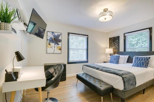a bedroom with a bed and a desk at Modern Raleigh Vacation Rental about 3 Mi to Downtown! in Raleigh