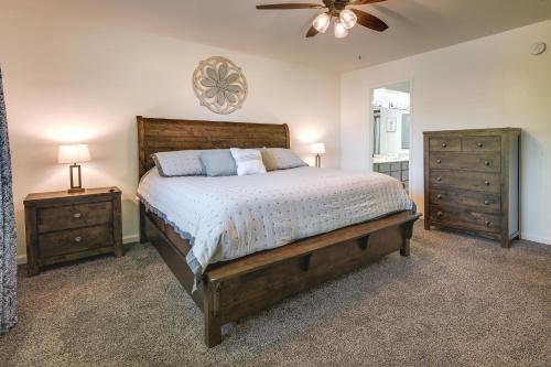 a bedroom with a large bed and two night stands at Inviting Branson Condo with Community Pool and Hot Tub in Branson