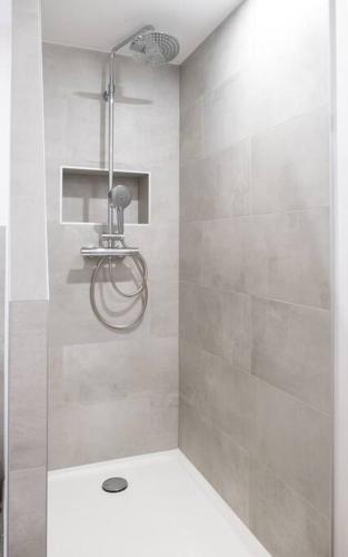 a bathroom with a shower with a toilet in it at Nouveau - Le Privacy - Europa Park in Sand