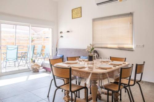a dining room with a table and chairs at Nouveau - Le Privacy - Europa Park in Sand