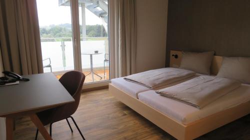 Posteľ alebo postele v izbe v ubytovaní Gasthof Hasen