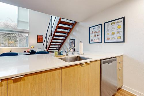 a kitchen with a sink and a counter at Central Loft in Seattle