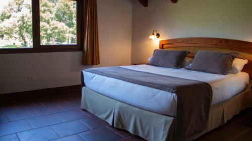 Ένα ή περισσότερα κρεβάτια σε δωμάτιο στο Hotel Pucon Green Park
