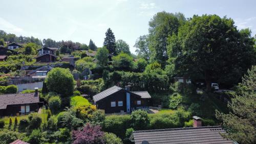 a view of a village with houses and trees at Chalet Spessart in Dammbach