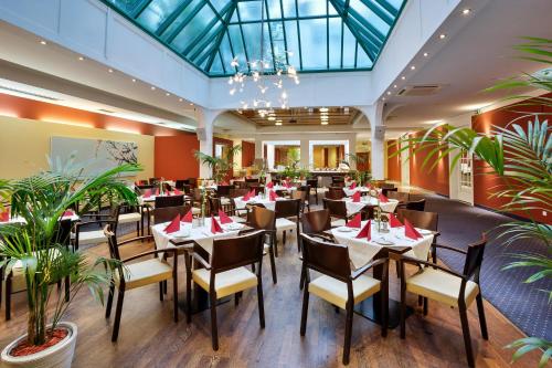 Ein Restaurant oder anderes Speiselokal in der Unterkunft Austria Trend Hotel Ananas Wien 