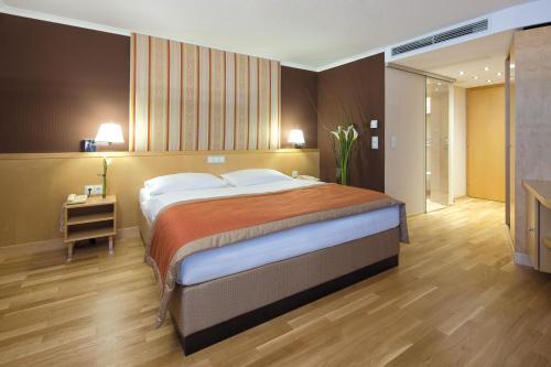 Ein Bett oder Betten in einem Zimmer der Unterkunft Austria Trend Hotel Ananas Wien