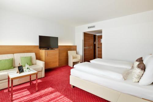 Postel nebo postele na pokoji v ubytování Austria Trend Hotel Anatol Wien